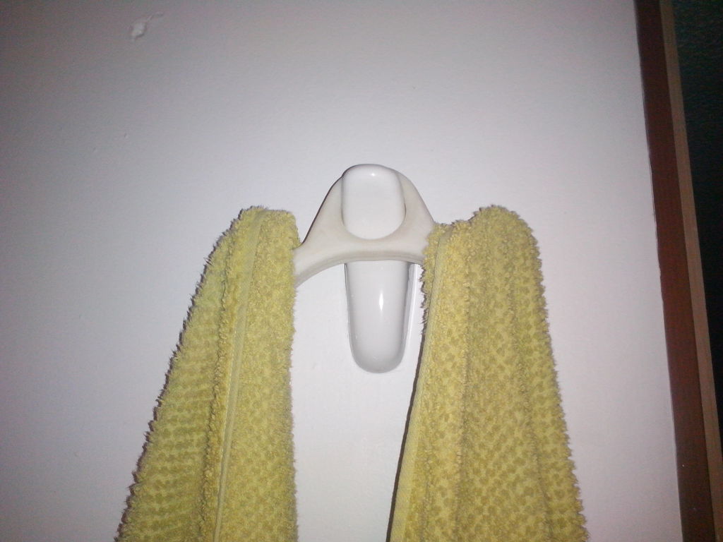 Towels mustache holder on wall