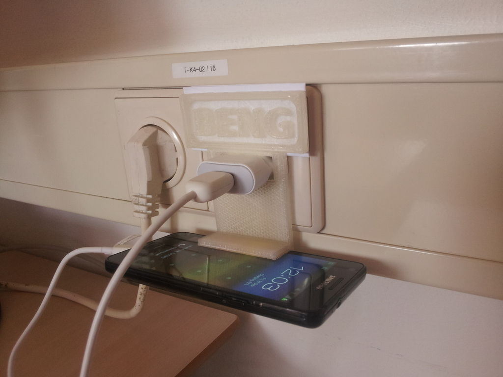 Wall plug cell phone holder